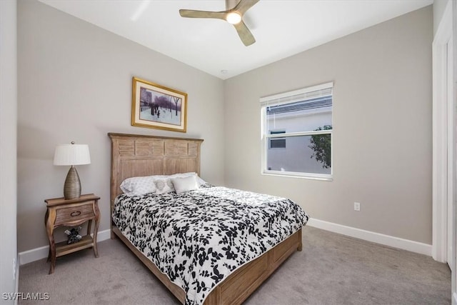 bedroom with baseboards, a ceiling fan, and carpet flooring