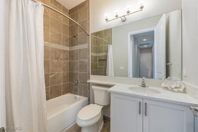 bathroom with vanity, toilet, and shower / tub combo