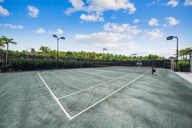 view of sport court with fence