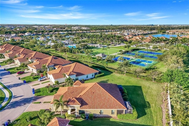 drone / aerial view featuring a residential view and a water view