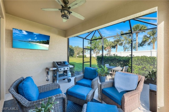 view of patio / terrace featuring a lanai, an outdoor living space, a grill, and ceiling fan