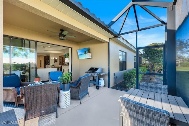 view of patio with a lanai, area for grilling, an outdoor living space, and ceiling fan