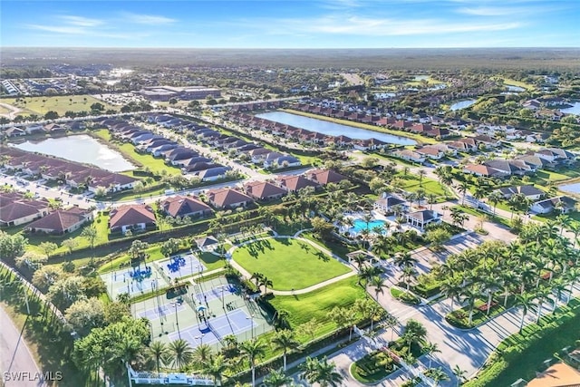 drone / aerial view featuring a residential view and a water view