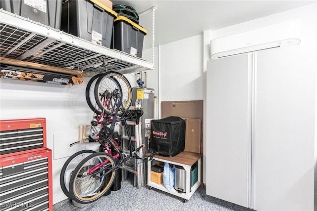 interior space featuring white refrigerator, gas water heater, and a wall mounted air conditioner