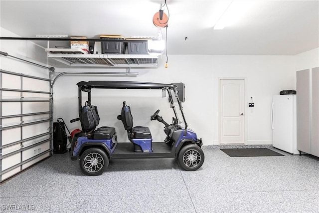 garage with freestanding refrigerator