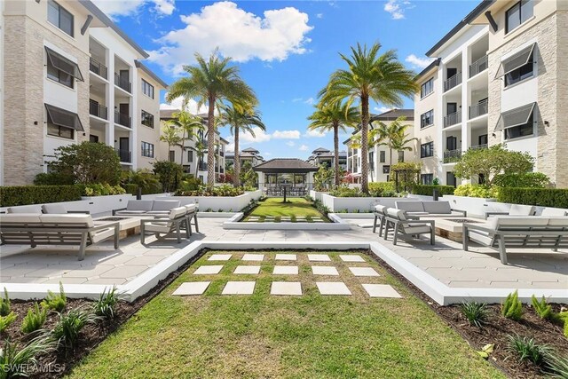 1135 3rd Ave S Unit 317, Naples, FL 34102 - surrounding community with an outdoor hangout area, a gazebo, a yard, and a patio area