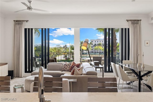 living area featuring ceiling fan