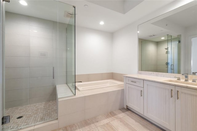 full bath featuring vanity, visible vents, recessed lighting, a shower stall, and a bath