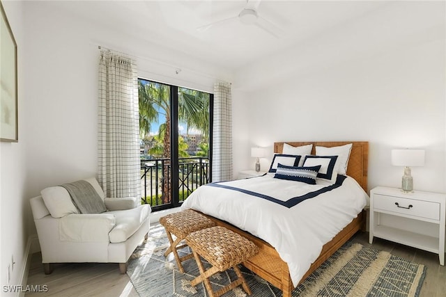 bedroom with access to exterior, wood finished floors, and ceiling fan