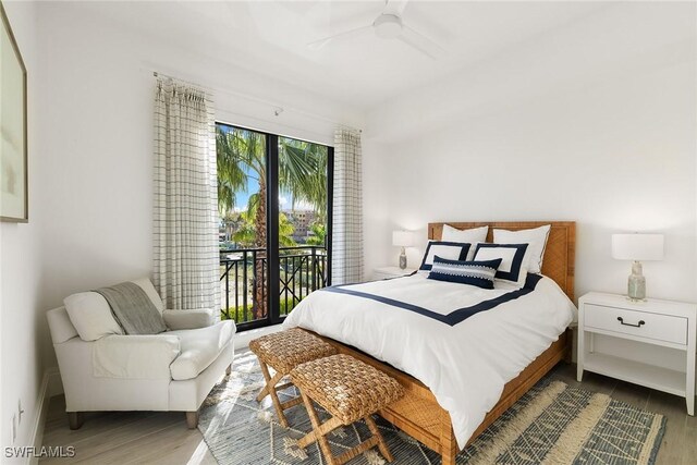 1135 3rd Ave S Unit 317, Naples, FL 34102 - bedroom with access to outside, wood finished floors, and a ceiling fan