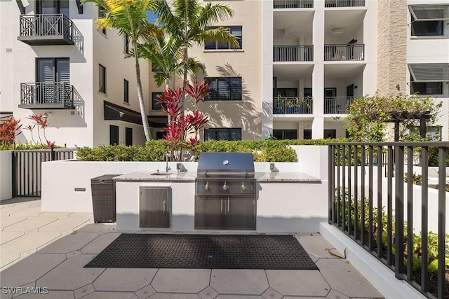 view of patio / terrace featuring a sink, area for grilling, and a grill