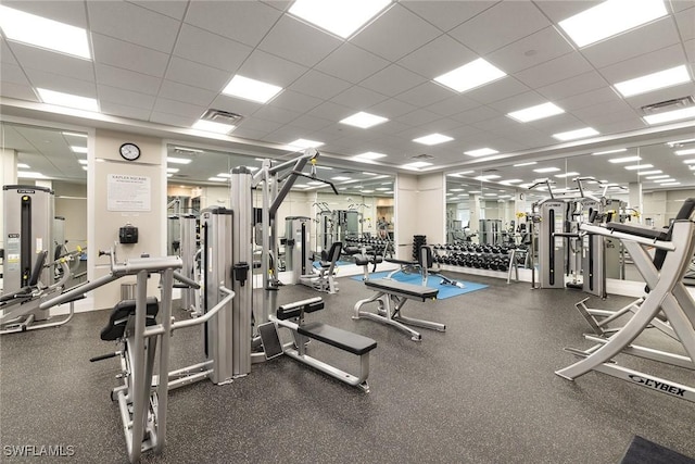 workout area with visible vents and a drop ceiling