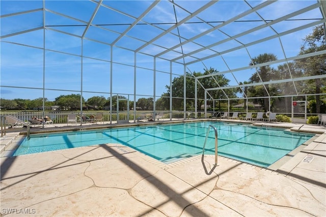 community pool featuring a lanai and a patio area