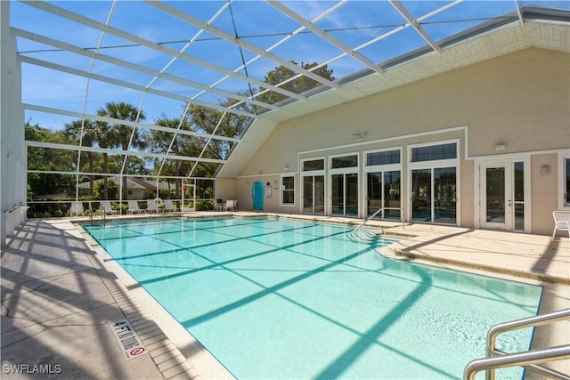 community pool with a lanai and a patio