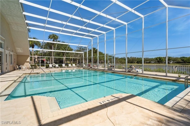 community pool featuring fence, a lanai, and a patio area