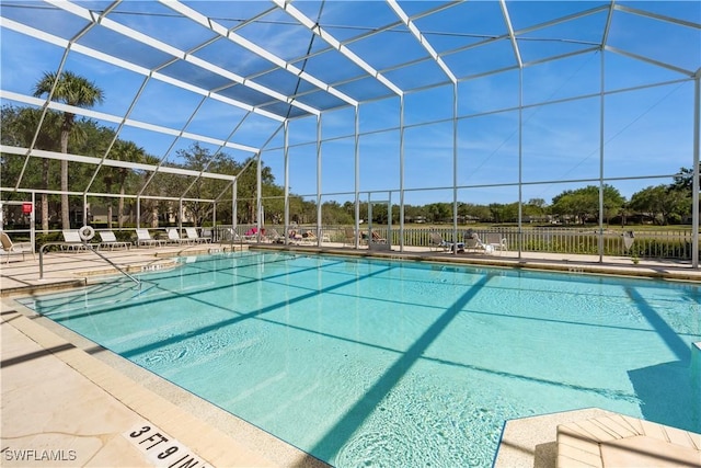 community pool featuring a patio and a lanai