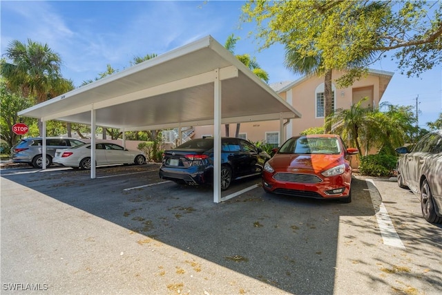 view of partially covered parking lot