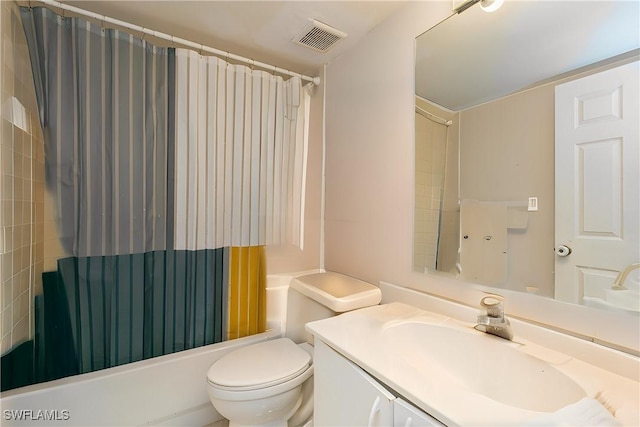 full bathroom featuring visible vents, vanity, toilet, and shower / tub combo with curtain