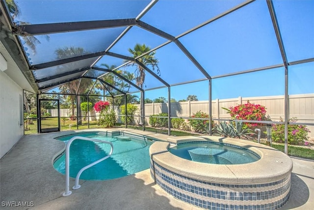 12488 Kelly Pine Ct, Fort Myers, FL 33908 - view of pool featuring a patio area, a fenced backyard, a pool with connected hot tub, and a lanai