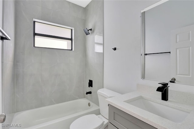 full bathroom with bathtub / shower combination, vanity, and toilet