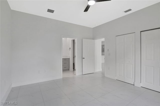 unfurnished bedroom with a ceiling fan, visible vents, ensuite bath, and baseboards