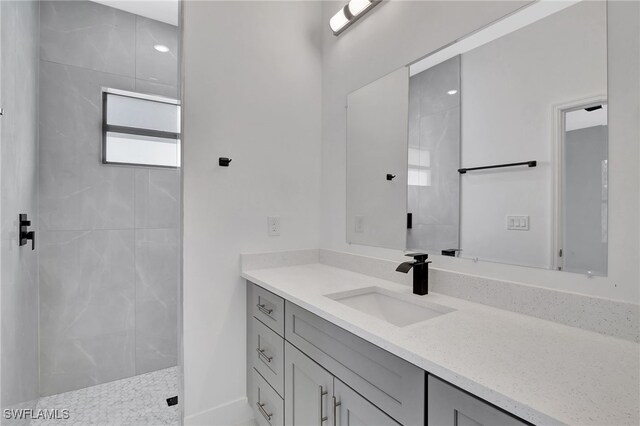 bathroom featuring vanity and walk in shower