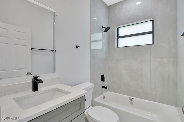 full bath with washtub / shower combination, vanity, and toilet