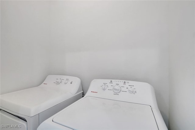 laundry room featuring separate washer and dryer