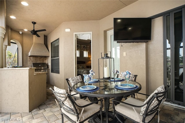 view of patio with outdoor dining space, ceiling fan, grilling area, and area for grilling