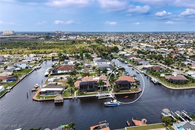 aerial view with a residential view and a water view