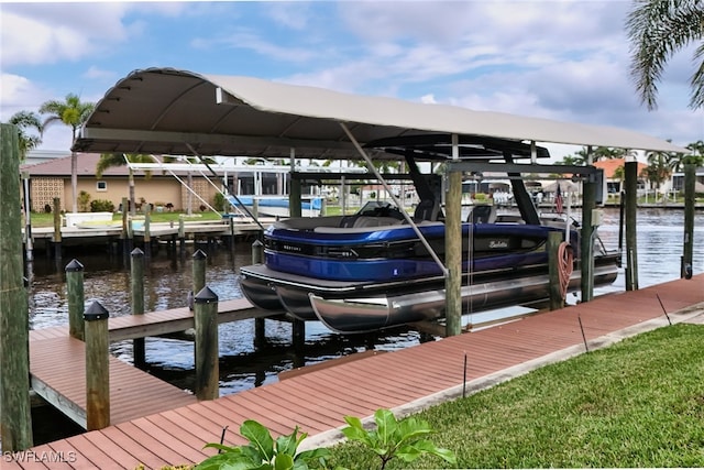 view of dock featuring a water view and boat lift