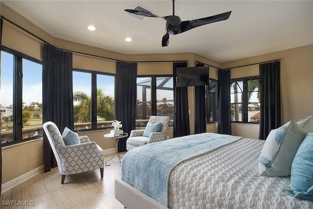 bedroom featuring light wood finished floors, recessed lighting, visible vents, ceiling fan, and baseboards