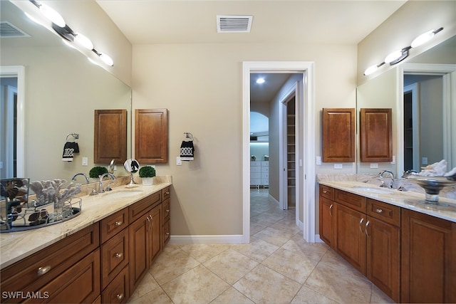 full bath with tile patterned flooring, visible vents, and vanity