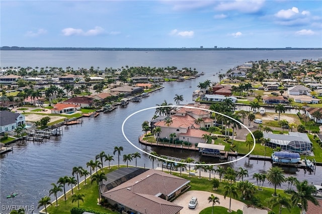 aerial view featuring a water view and a residential view