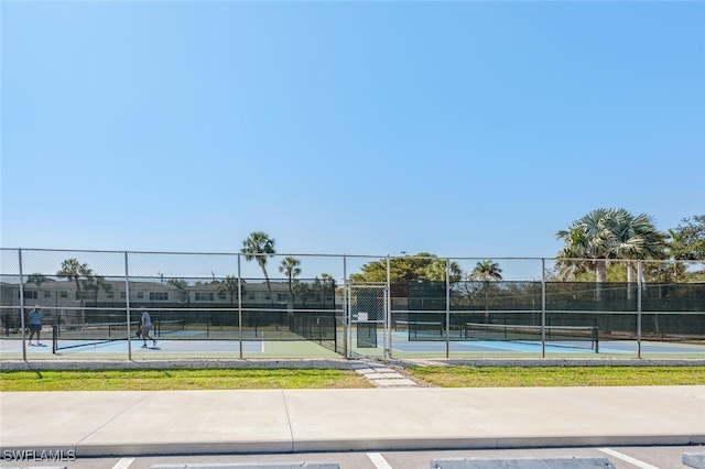 view of sport court with fence