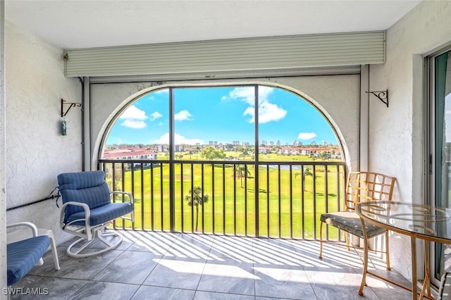 sunroom / solarium featuring a view of city