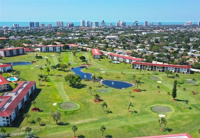 bird's eye view featuring a view of city, a water view, and golf course view