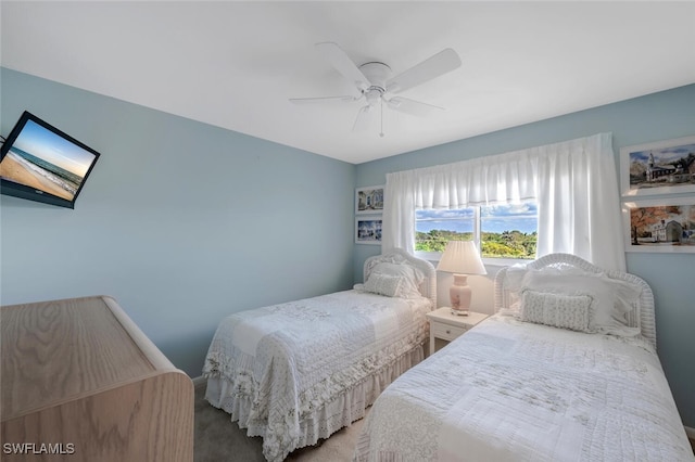 carpeted bedroom with a ceiling fan