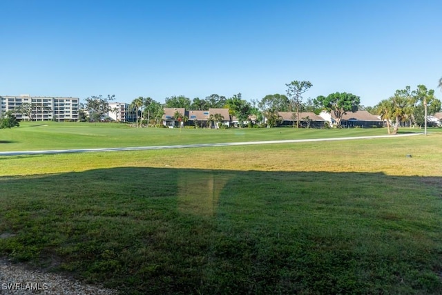 surrounding community featuring a yard