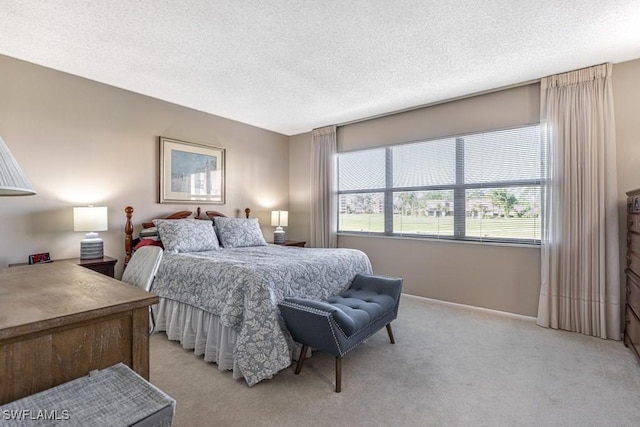 bedroom featuring a textured ceiling, baseboards, and light colored carpet