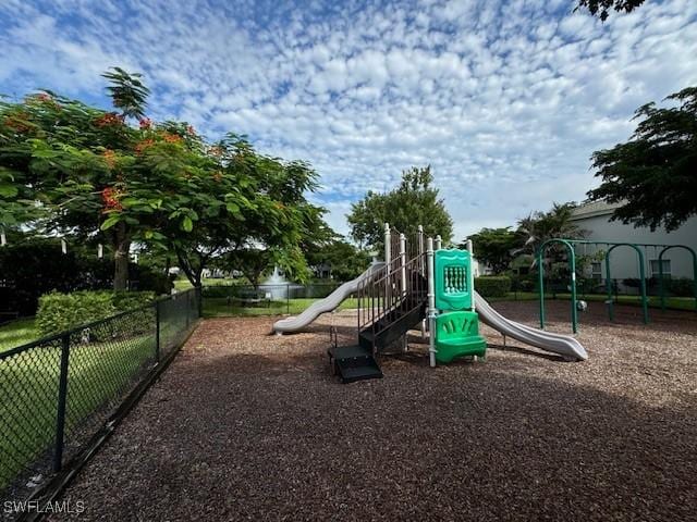 community jungle gym featuring fence