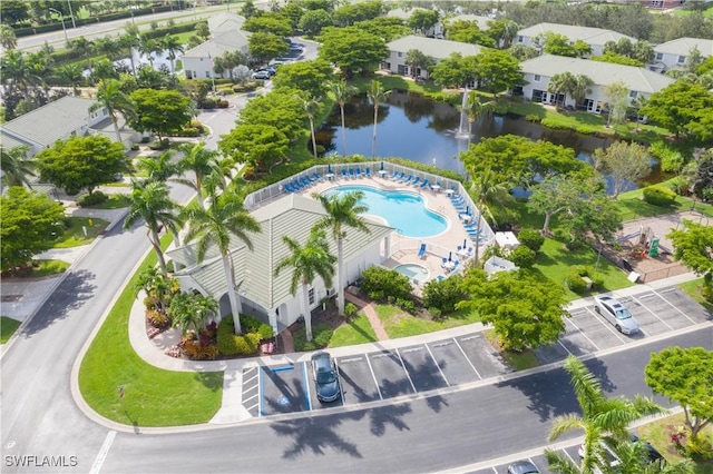 birds eye view of property with a residential view and a water view