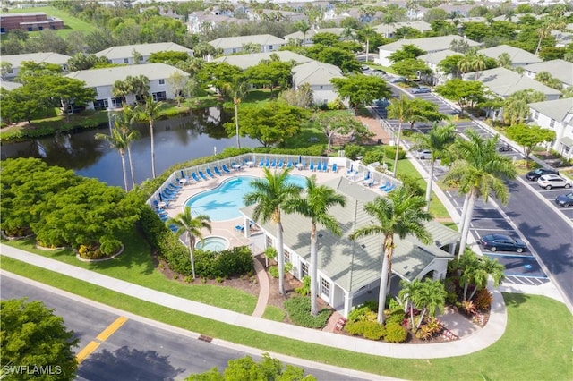 bird's eye view featuring a residential view and a water view