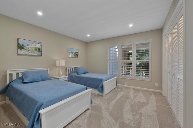 carpeted bedroom with recessed lighting and baseboards