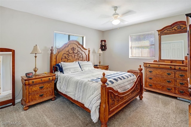 bedroom with light colored carpet and ceiling fan