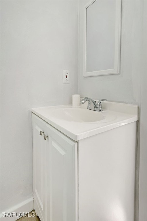 bathroom featuring vanity and baseboards