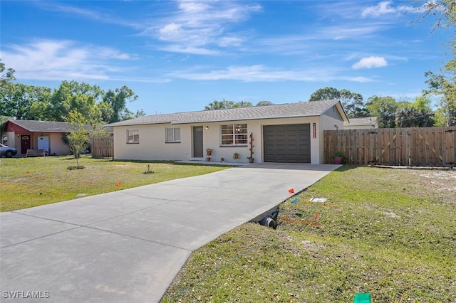 ranch-style home featuring a garage, a front lawn, fence, and stucco siding