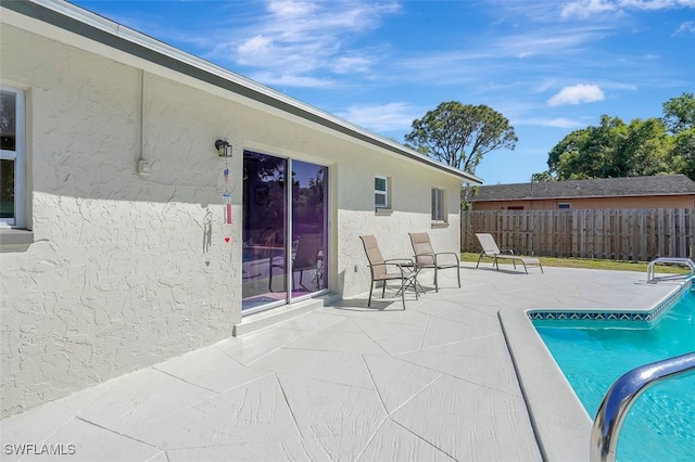 view of patio / terrace featuring fence and a fenced in pool