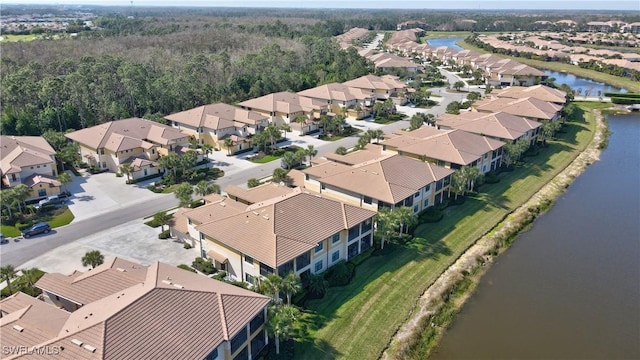 bird's eye view with a residential view and a water view