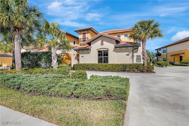 mediterranean / spanish home with stucco siding